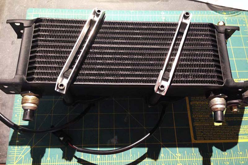 Here is a photo of the C channels on the front of the cooler. They sit on 1/8" neoprene pads and are cut out in the middle to maximize air flow.