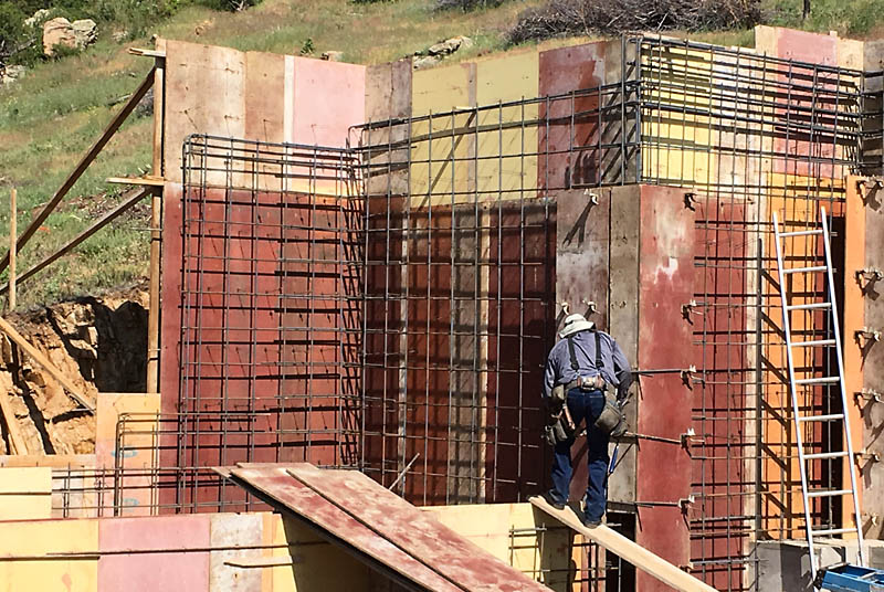 The west and north side of the west carport retaining wall is shown here. The carports are about 8 feet shallower than the width of the house.