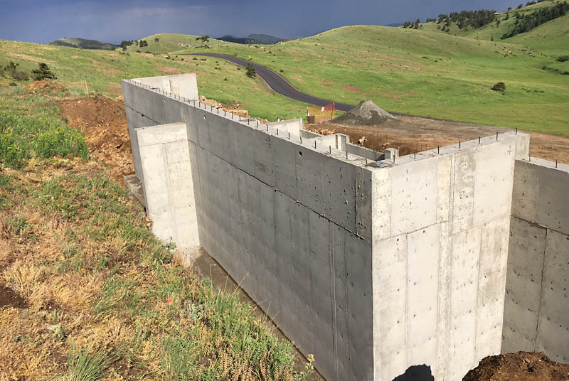 Another view of the foundation showing the counterfort on the north wall. A heavy rain storm that just passed over us is visible in the eastern background. <span class='myGreyFont'>[End of series.]</span>