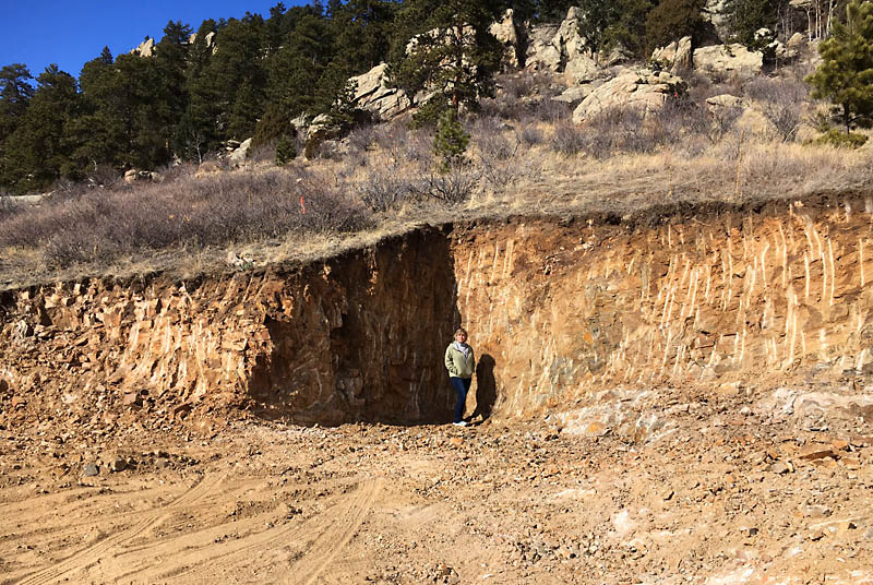 Here is Kris standing at the base of the initial cutout for the house. The wall behind her is 12 feet tall. The cutout was eventually increased to 15 feet deep for the foundation.