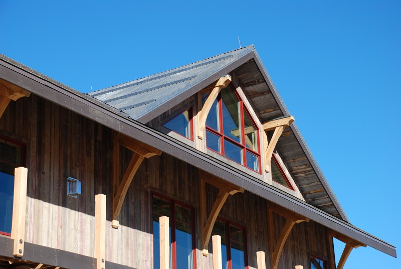 This is a close shot of the corrugated steel on the south–facing dormer. The horizontal steel ridges are snow stops. You can also see lightning rods along the ridge.