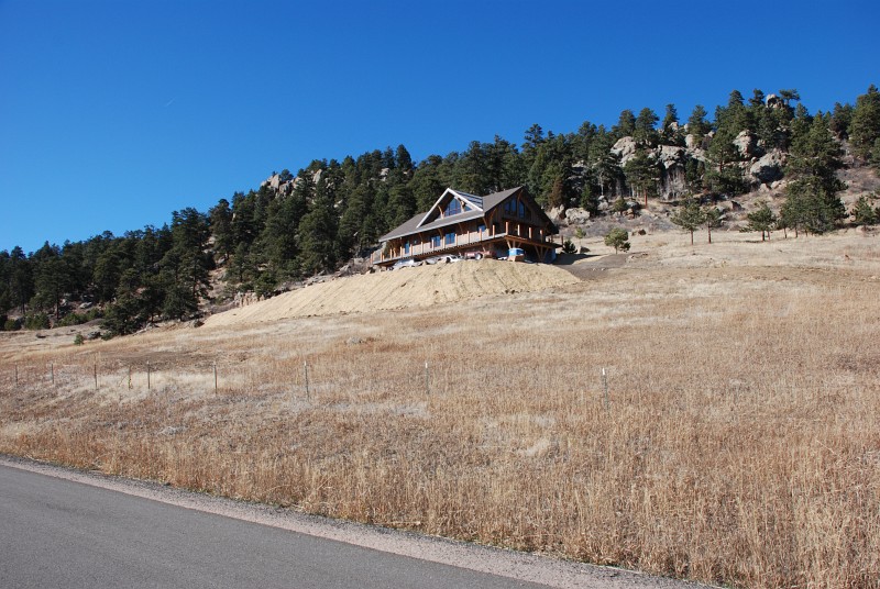 Another view from the county road. The straw erosion control mats hold grass seed in place on steeper slopes. The mats should disappear as grass takes hold next spring.