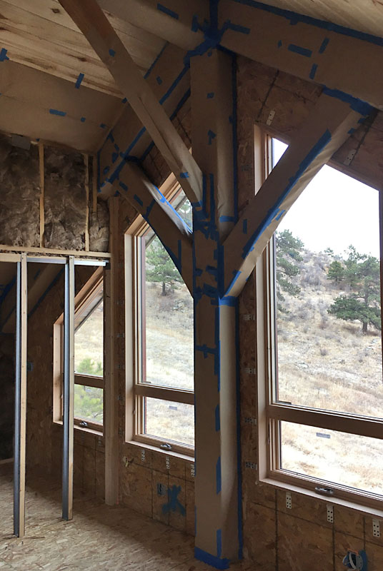 This is the east wall of the loft near the 3/4 bath. The braces are wrapped up like Christmas presents.