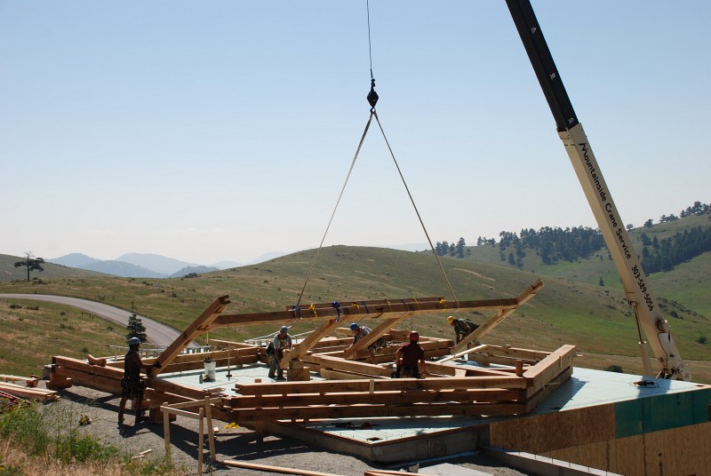 The first bent to placed is bent 6. It is so large that it will be hoisted into place in two pieces. A strongback — a temporary reinforcing beam — has been strapped to the back of the beam that supports the loft.