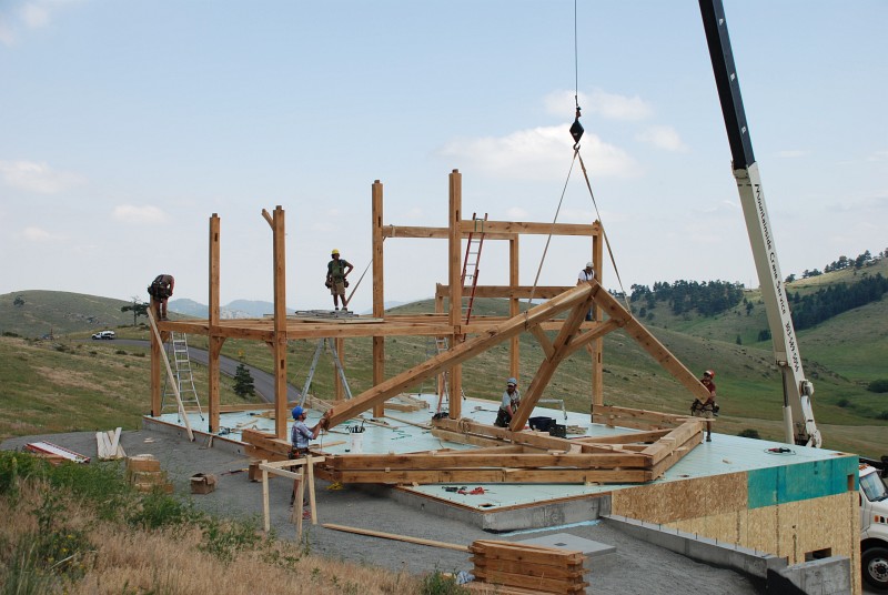 The rafters for bent 6 are being lifted by the crane.