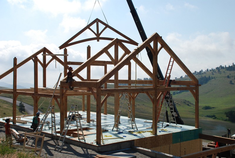 Here bent 2.5 is being lifted into place. This bent is a rafter with a curved element that will be visible in the living room.