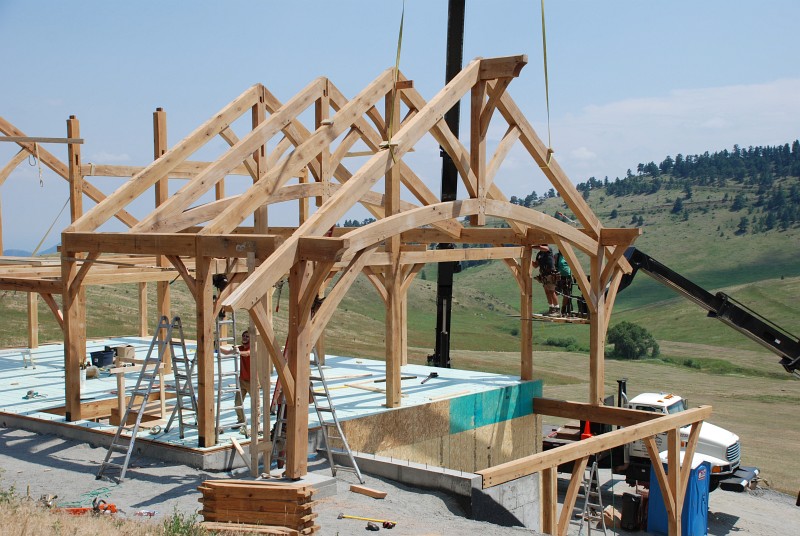 Bent 1 lands on a beam above the west carport and a footing northwest of the foundation.