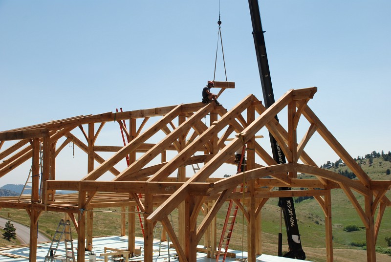 Harris is fitting another ridge beam segment into place. He spent a lot of time sitting up there!