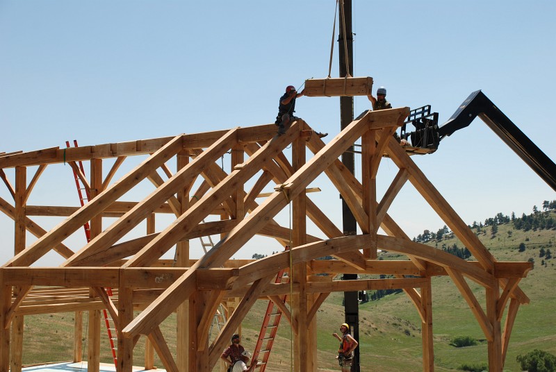 The last ridge beam segment is dropped into place.