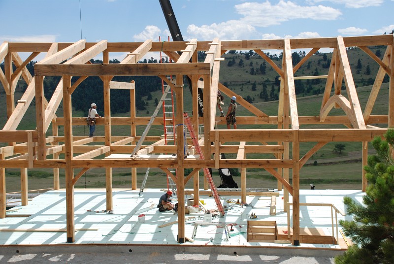 The first rafter for the gable on the south side of the house is set.