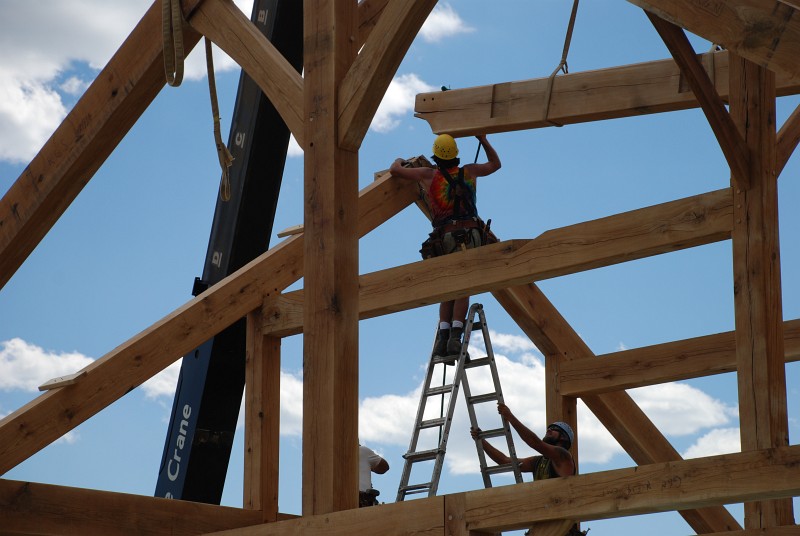 Matt sets the beam that connects the gable to the ridge.