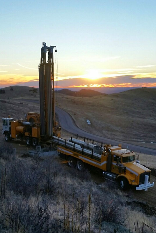 A great shot of the drilling rig at sunrise. The well is 451 feet deep with water starting at 150 feet below the surface and produces 6.1 gallons per minute. (Photo credit Derek Best.)