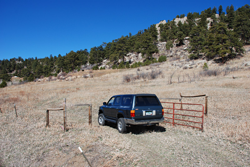 Looking northwest. The property is fenced with barbed wire, although the fence wanders back and forth across the property line. Our neighbor was repairing his barbed wire fence to keep the cows in after some elk knocked it down.