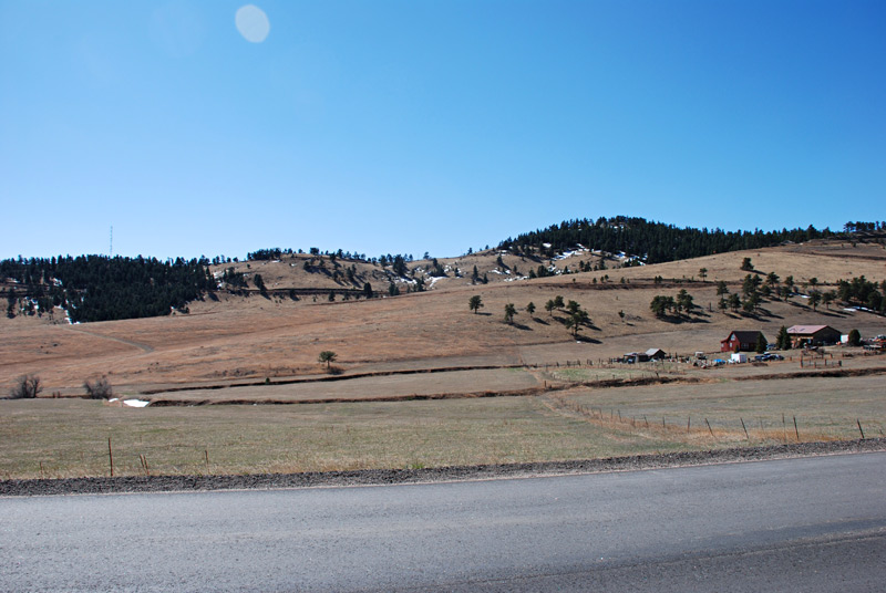 Another view from our property to the south. On the hill just behind the farm house, there is a windsock. A retired United Airlines captain built a house, a hangar and a short runway on the hill some years ago. Apparently he shows up every Monday in his Piper Cub for some touch and goes.