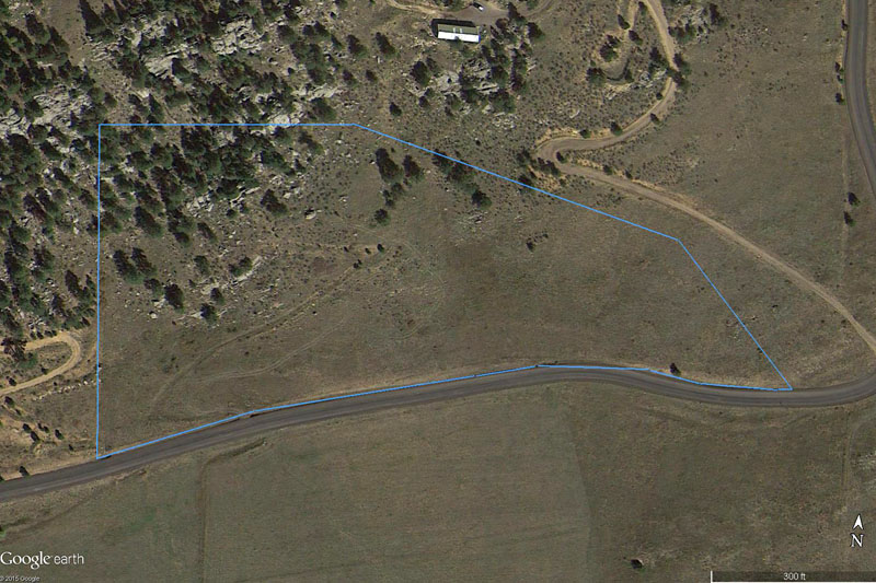 This is from Google Earth. The blue outline is our lot. <span class='myGreyFont'>[End of series. <a href='../../index.html'>Return</a> to the New House page.]</span>