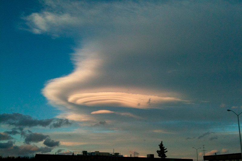 Altocumulus clouds over Anchorage. The smooth shape is due to high winds aloft.