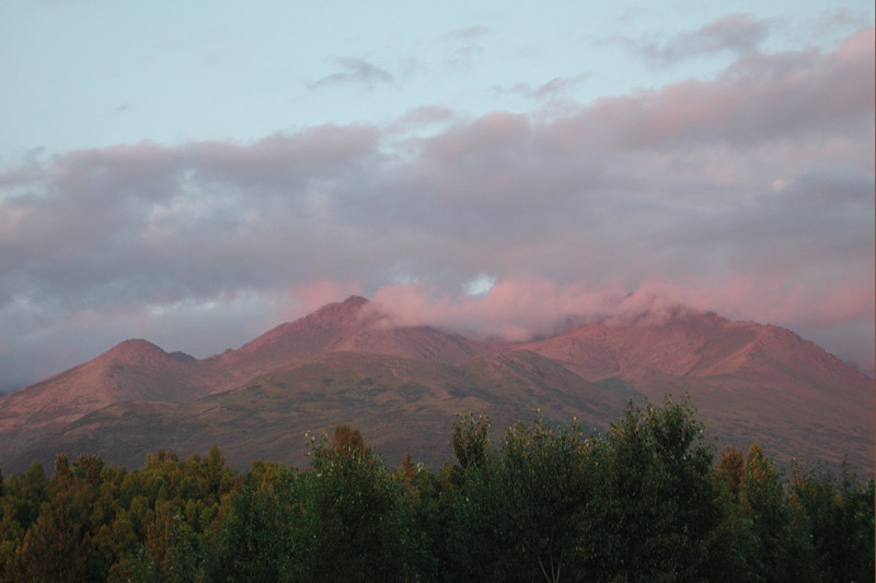 Low stratocumulus clouds hanging over the Chugach foothills just before an 11:00 pm sunset in Anchorage.