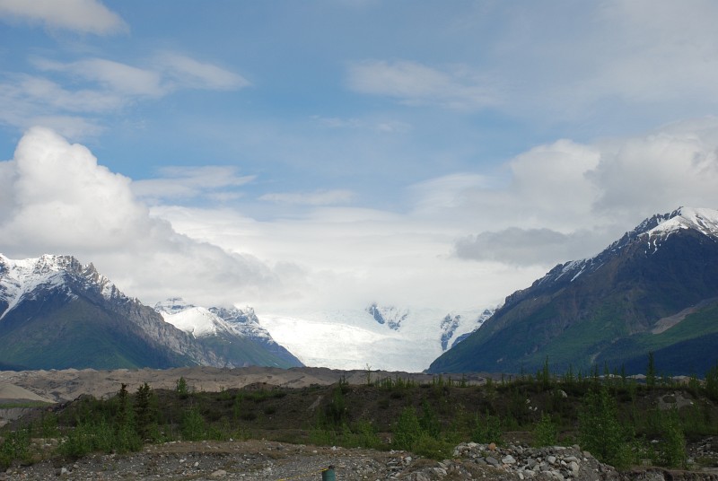 This is Kennicott Glacier seen a few miles out of Kennicott. The mounds of dirt in the foreground aren't from mining. They are glacial moraines ... dirt and rock left behind as the glacier retreated in the past.