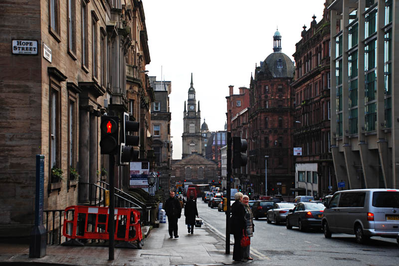 <h3>Miscellaneous Items</h3>Here's a street near the Merchant City district of Glasgow. The old buildings are in the Victorian style and are about 200 years old. The city is slowly cleaning coal dust that stains the old sandstone buildings.