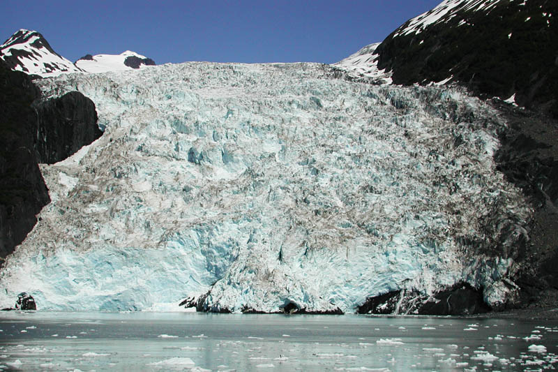 The scale of glaciers is deceiving. That flat face dropping to the water on the left is about 80 feet tall.